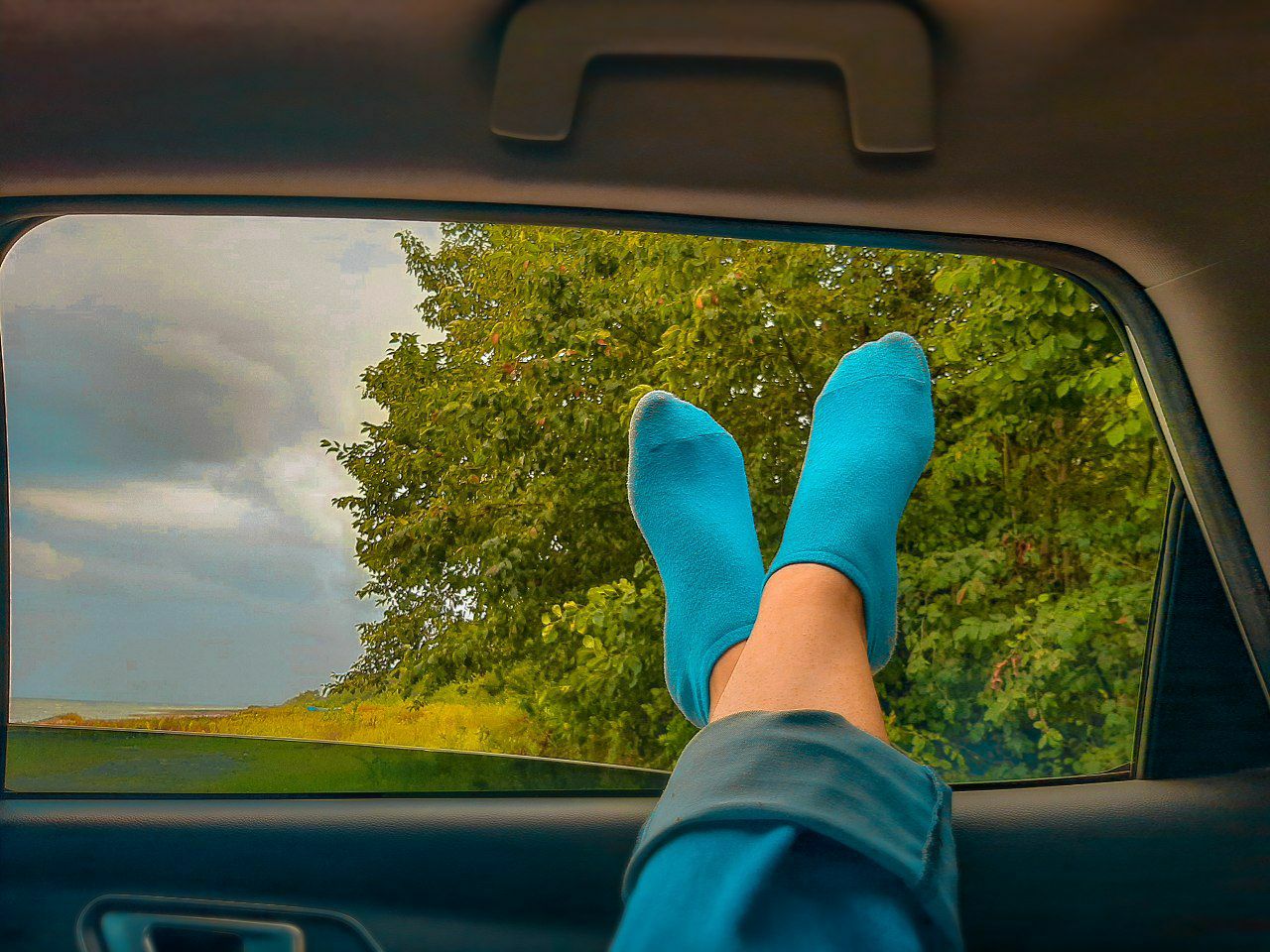 a person's foot in a car